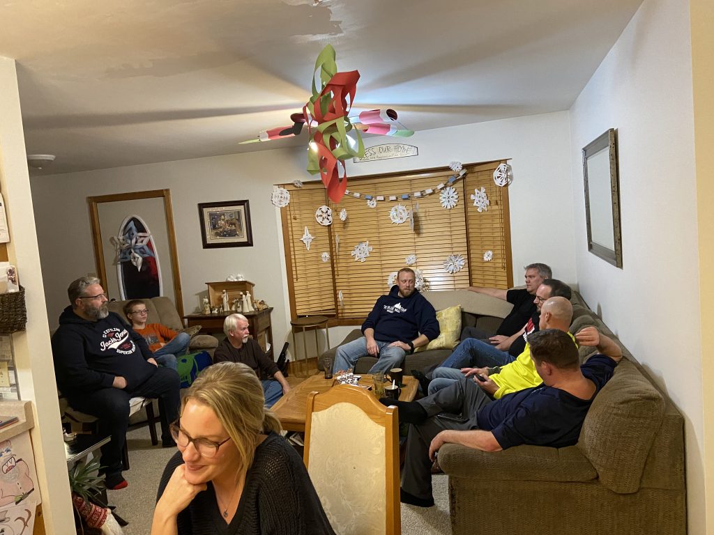 A grow group of people in a living room