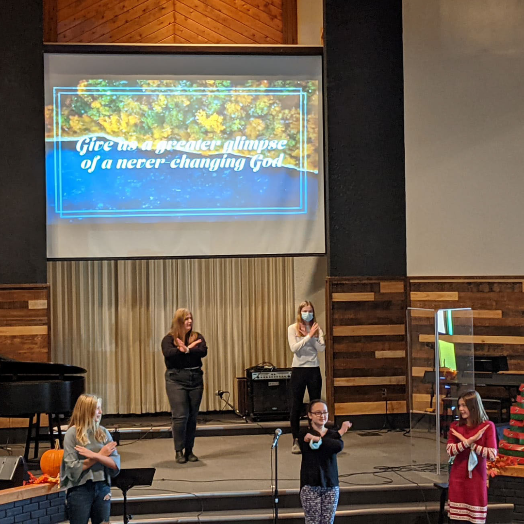 five girls leading family service at church